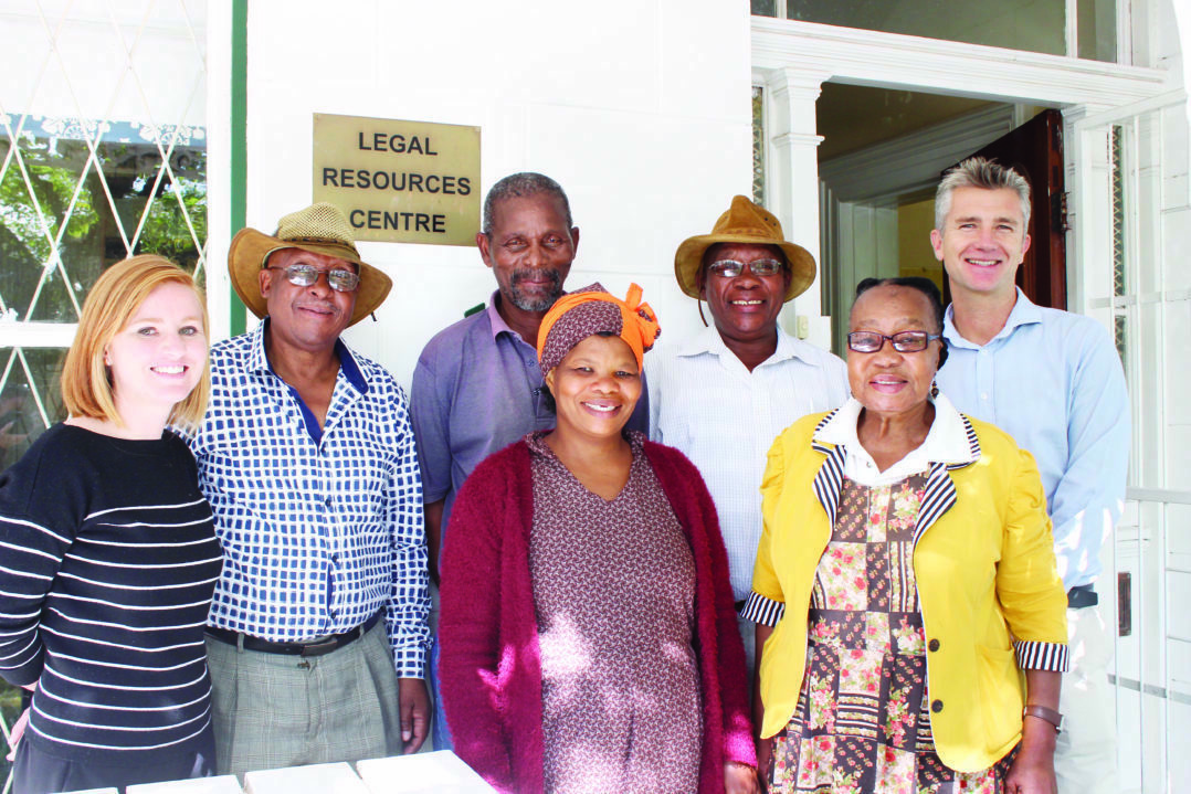 Legal Resources Centre staff flank jubilant members of the Prudh