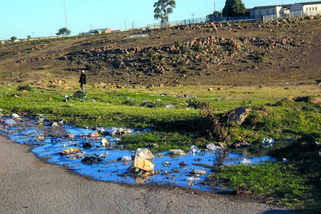A burst sewerage pipe in Thatha Street, Joza.  The pipe is near the Archie Primary School. © Siphamandla Boma.