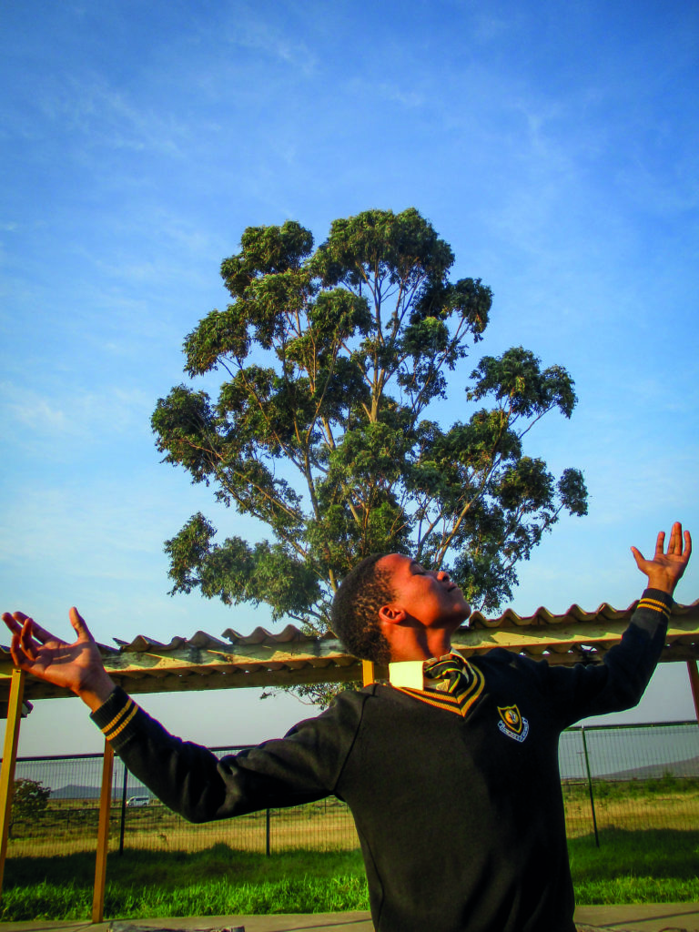 Oyama Vena posing for the camera on a sunny day at Nombulelo Senior Secondary. © Chulumanco Kuhlane.