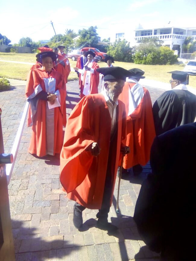Mr. Phumelelo Blow on Friday, 3 March, preparing to enter his graduation venue