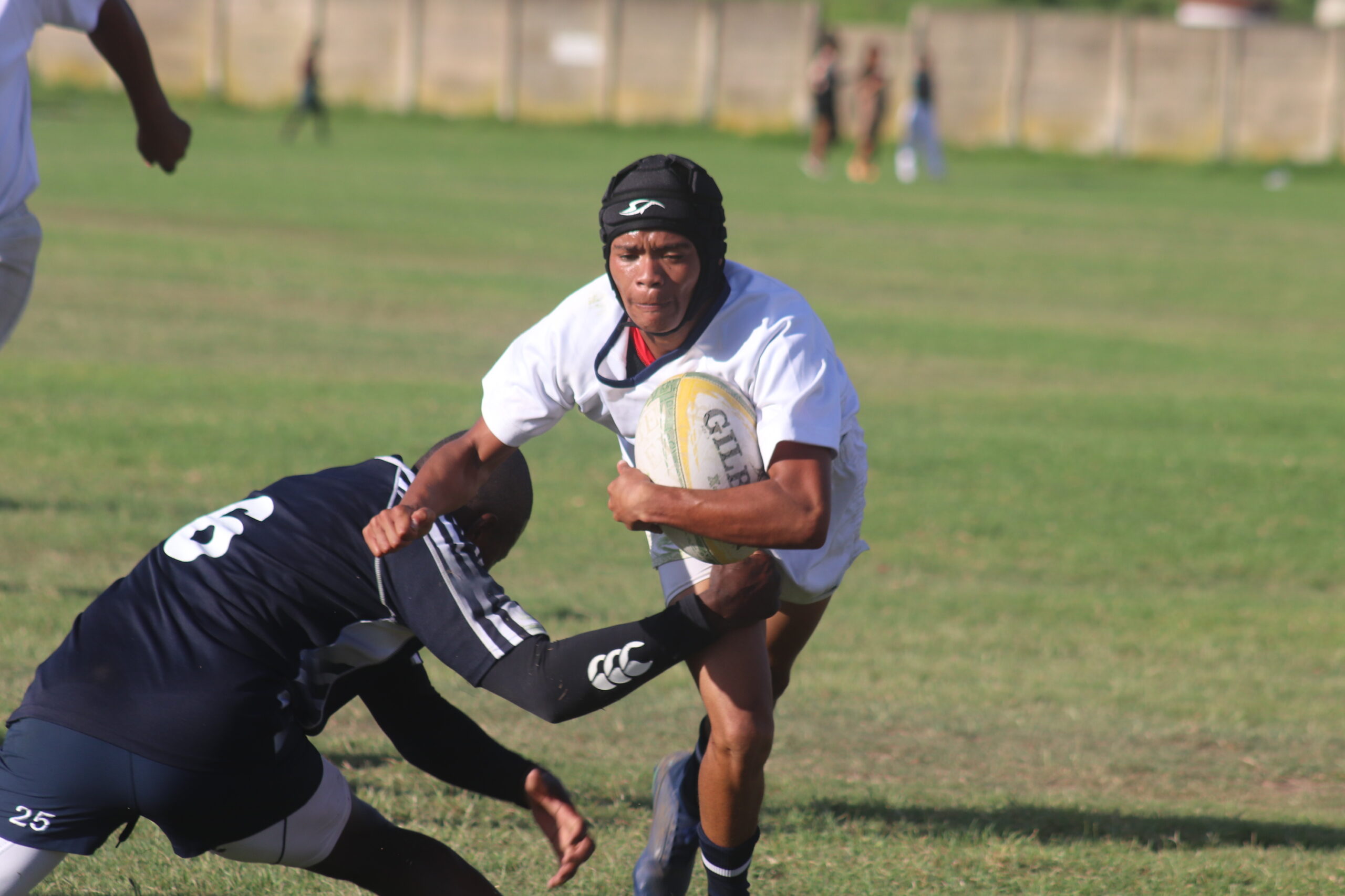 Young Swallows flyhalf Ethan Williams breaks through a tackle on attack. Photo: Chesley Daniels