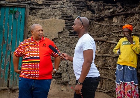 Deputy Director of the SACP in the Sarah Baartman District, Mr Mncedisi Bhoma (left) interviewed by Sipho Zono from SIZO MEDIA (middle) and Mama Regina looking at the construction site (right). Photo: Iviwe Haarmans.