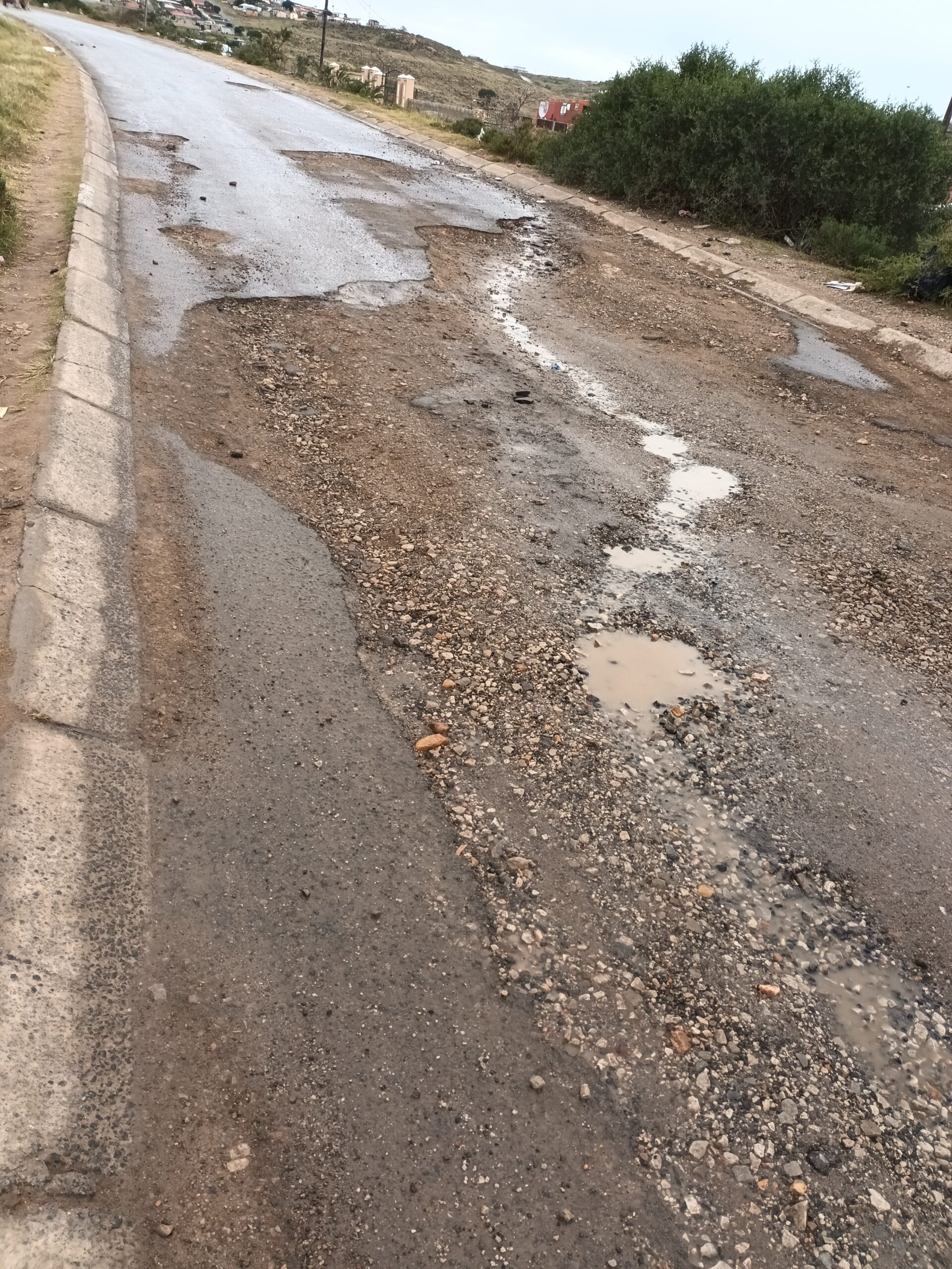 Road Cavity: The road that passes Mary Waters High School is filled with potholes and the regular street flooding causes even more damage. Photo: Ntombentsha Yamiso