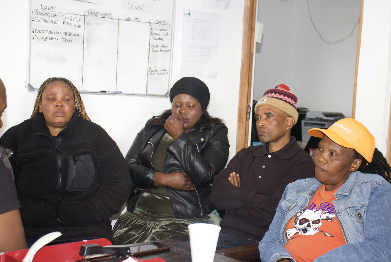 A room full of emotions. From left: Nombulelo Madikana, Mbali's neighbour, Vuyokazi Ncula, community task team member, Ntsikelelo January, Mbali's step father, Vuyokazi Koba, Mbali's mother. Photo: Linda Pona