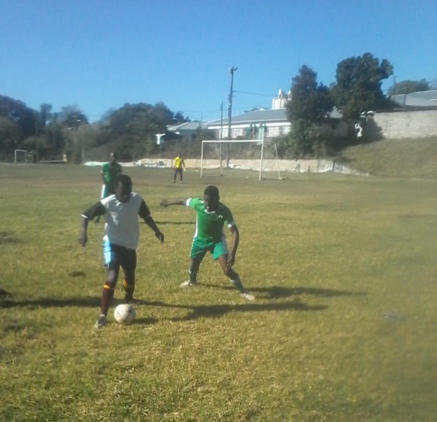 Siviwe Mandevu of XI Attackers securing the ball from a Callies defender