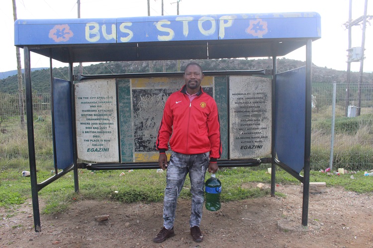 Sinekhaya Kolweno holding a 5L bottle of petrol at the Alicedale Bus Stop waiting for a lift. Photo: Benny Mojela