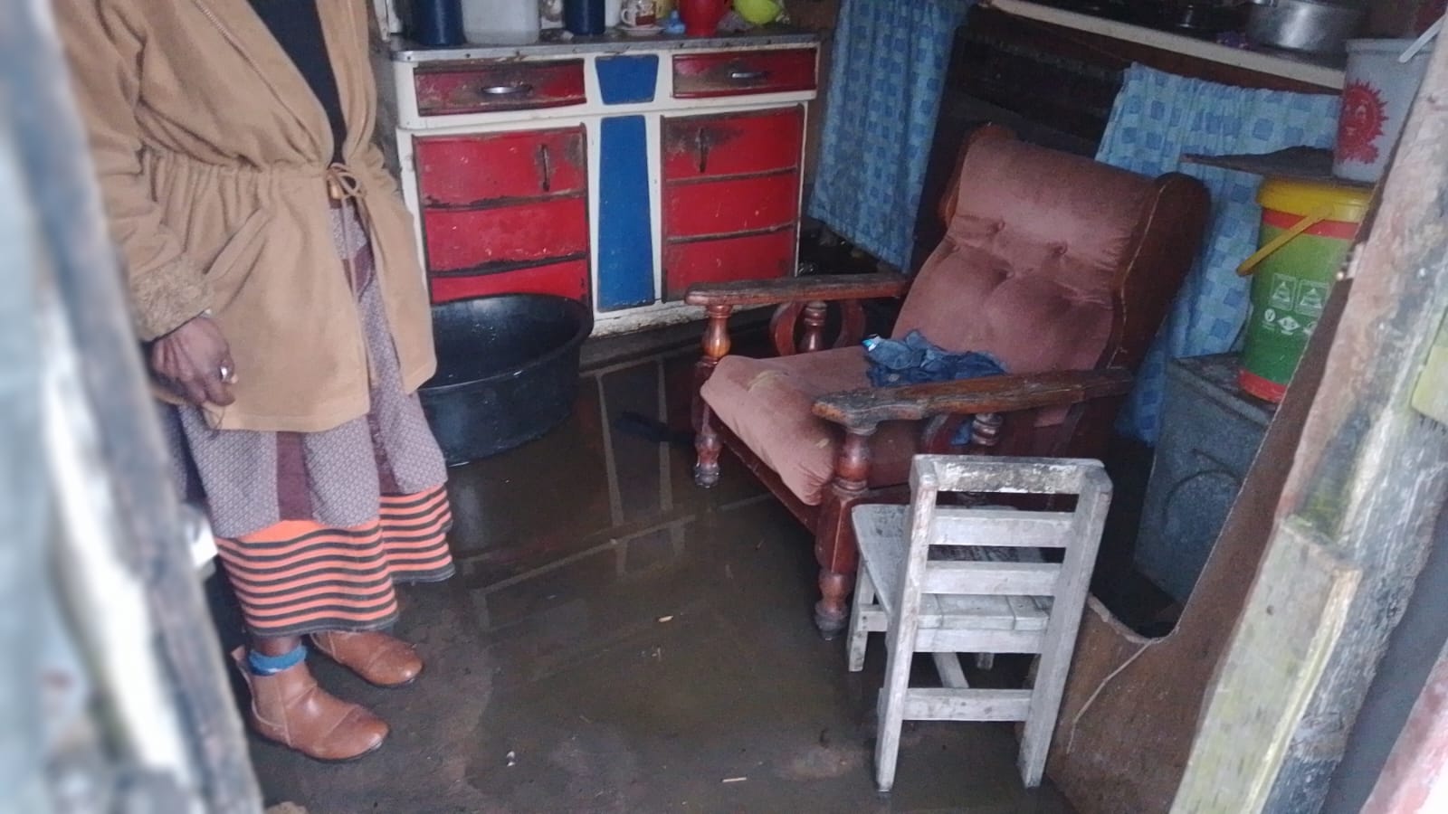 Shackled in a shack: 63-year old pensioner Thembeka Dingana stands in a pool of water inside her house, after moderate to heavy rains hit Makhanda recently. Photo: supplied
