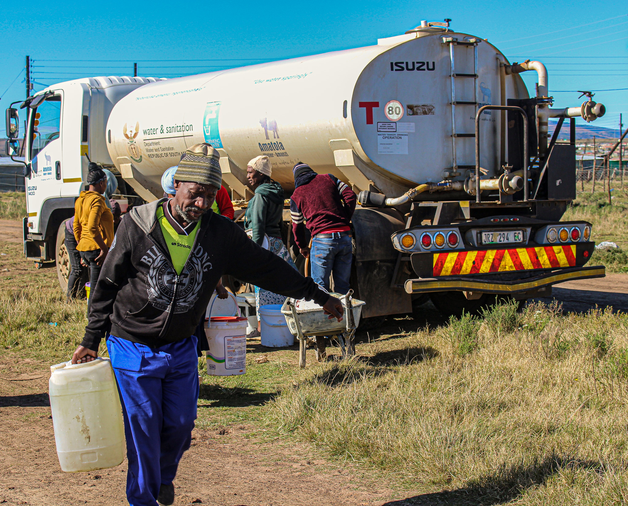 Nkanini residents filling their buckets with water from Amatola Water Truck.