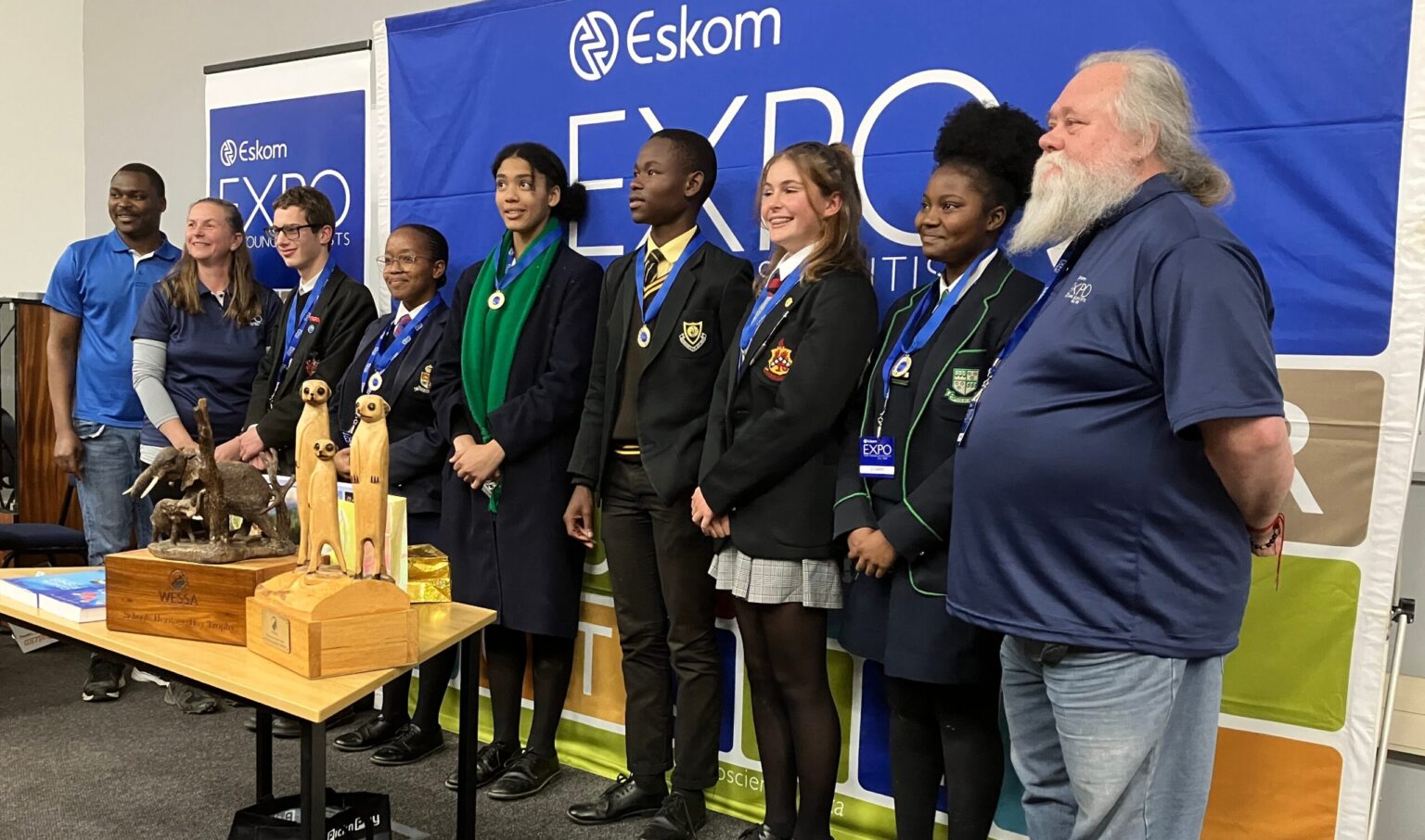 (From left) Eskom Expo provincial coordinator, Fredy Mashate; judge convenor, Nadia Czeredrecki-Schmidt and gold medal winners, Conré Henning, Dinisa Buhle, Mairi van Schoor, Alutha Botha, Savanna Renaud, Rutendo Chakona and chief judge Leo Goosen at the prize-giving. Photo: Steven Lang