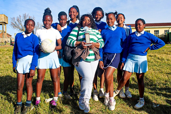 Ntaba Maria Netball team holding their Cup as they won the Netball Tournament.