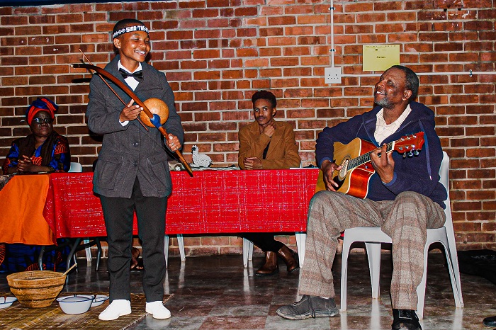 A poet, Sinomhlobo Ndlela creating beautiful music with Walter Tako, gospel acts. 