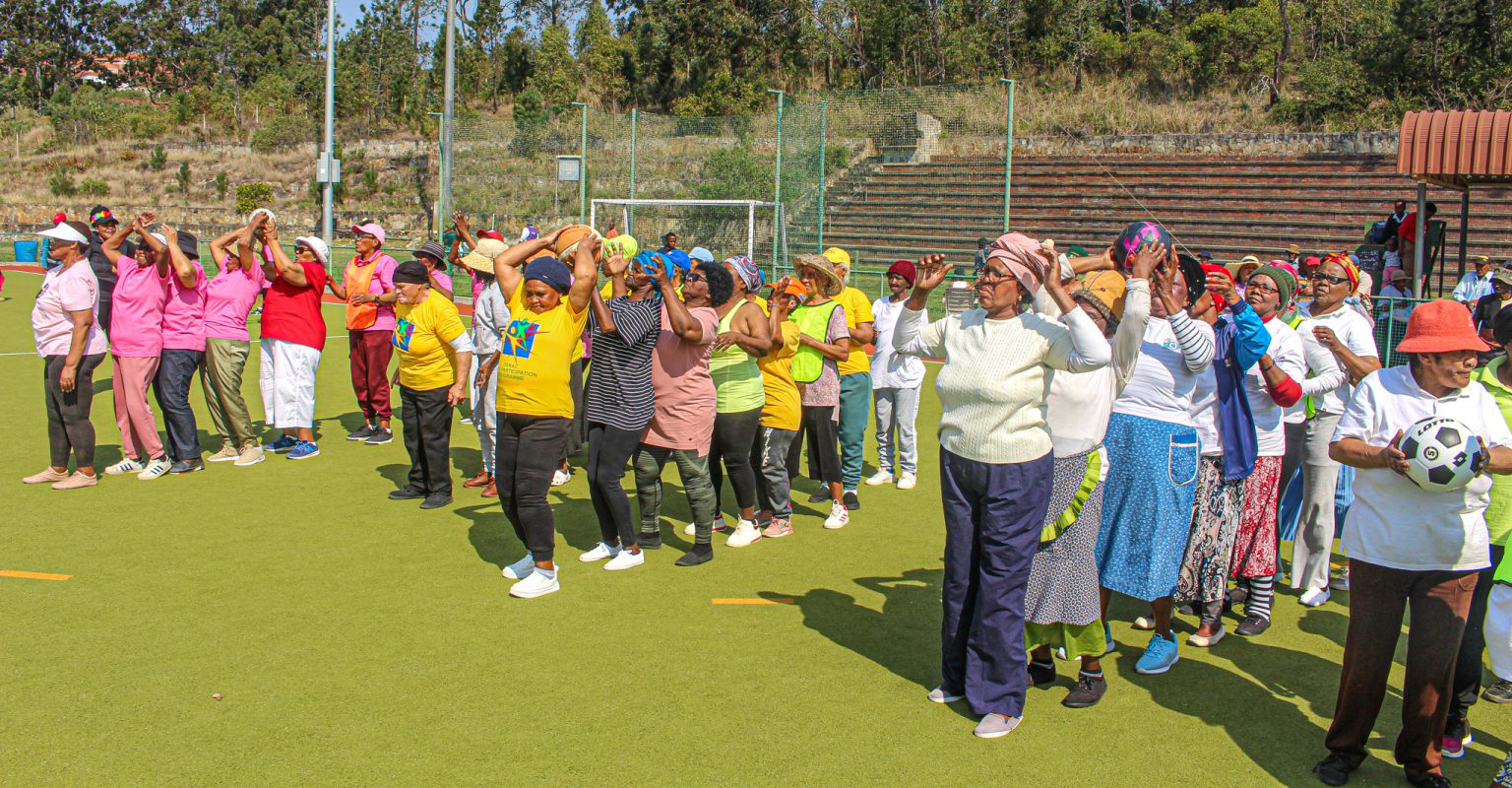 Grannies enjoying themselves playing pass the ball.