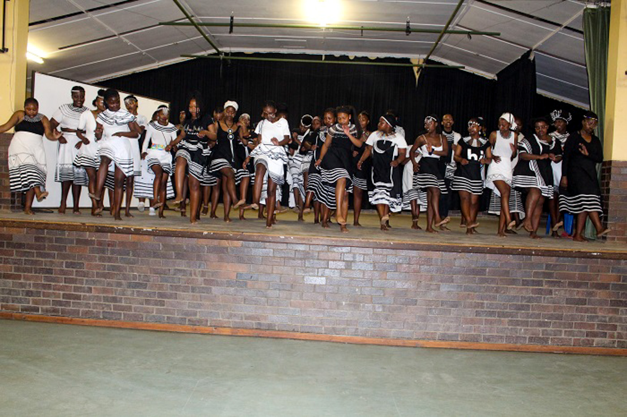 MYC female voices performing on stage. 