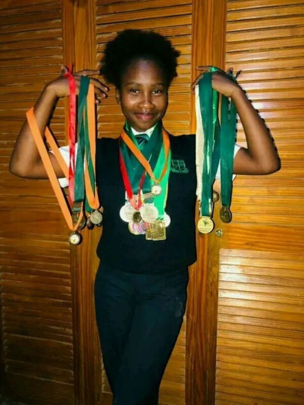 Siyolise carrying different medals evidence that she has been doing this its not the first