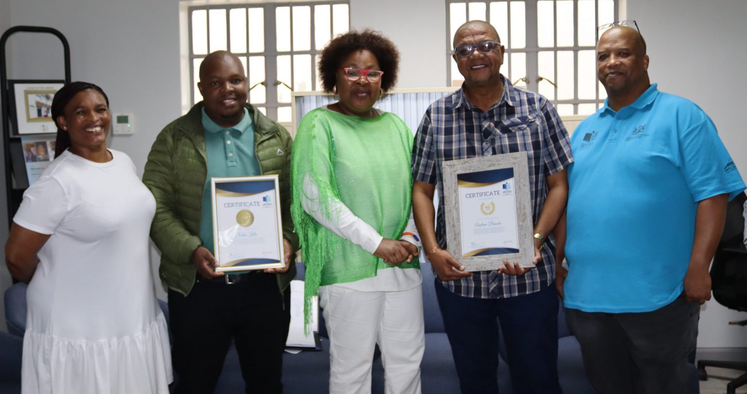 From Left to Right: Ms Patricia Magabie (Senior Library Officer), Mr Xola Kila (Library Dispatch Assistant), Dr Pateka Ntshuntshe-Matshaya (CEO), Mr Andrew Brooks (Digital Technical Assistant).