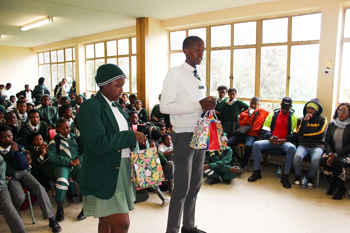 Fikizolo Primary School head boy Masimbonge Tyuthu and head girl Amila Magwaxaza handing over the gifts to judges of the day.