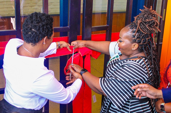 The Minister of Small Business Development, Stella Ndabeni-Abrahams and the Indoor Sport Centre Manager, Lulu Jakavula opening the doors of the Entrepreneurs Unlimited Incubator. 