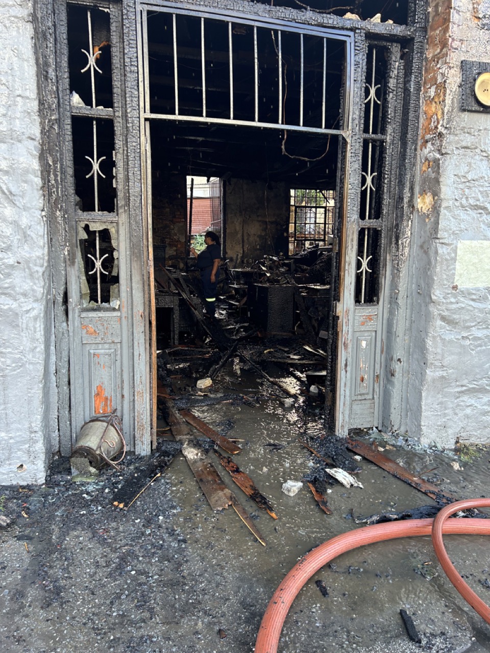 Glass and door entrance destroyed by fire. Photo: Linda Pona
