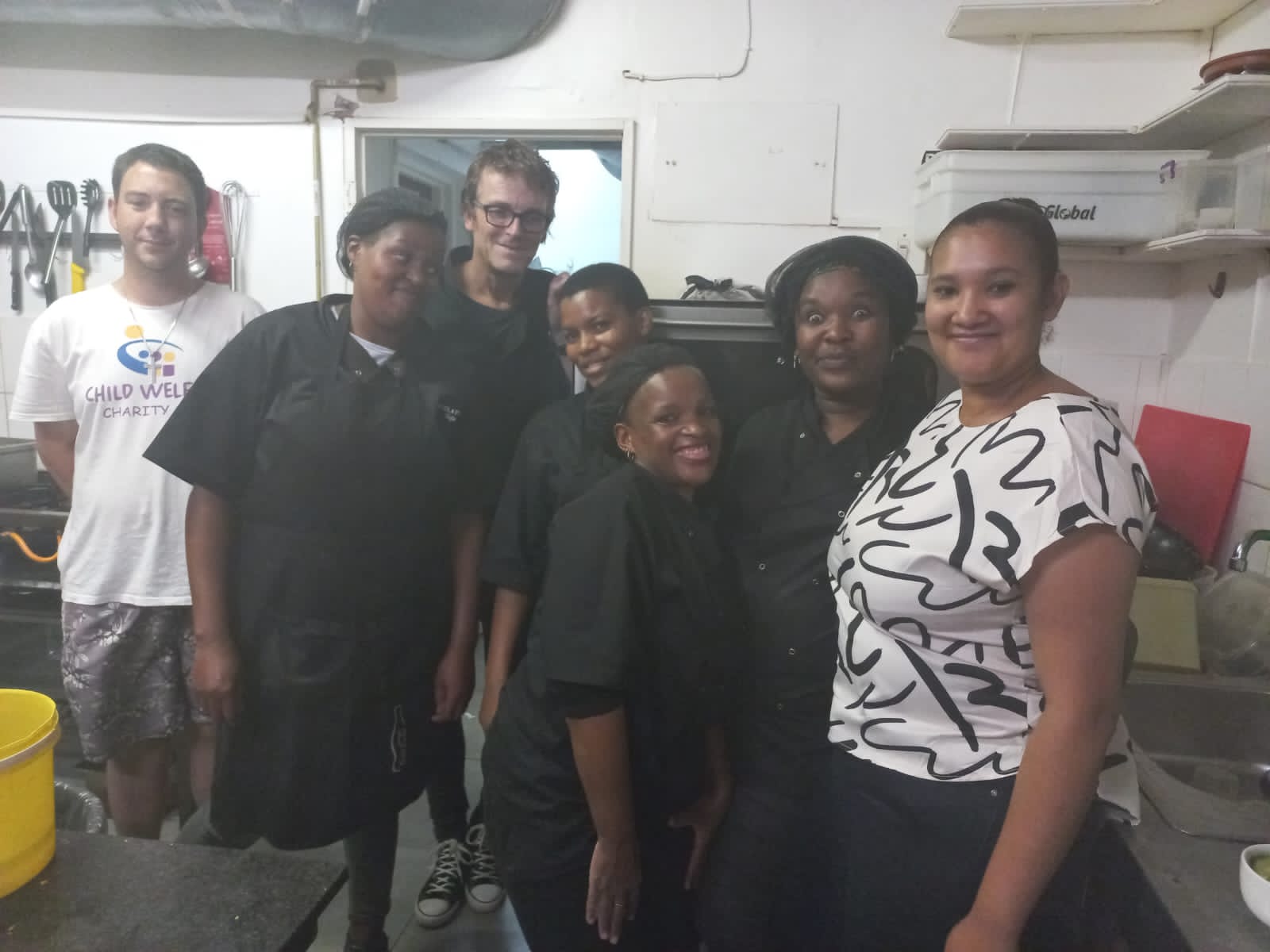Child Welfare and Revelation Cafe´staff during Burger Evening. Photo: supplied