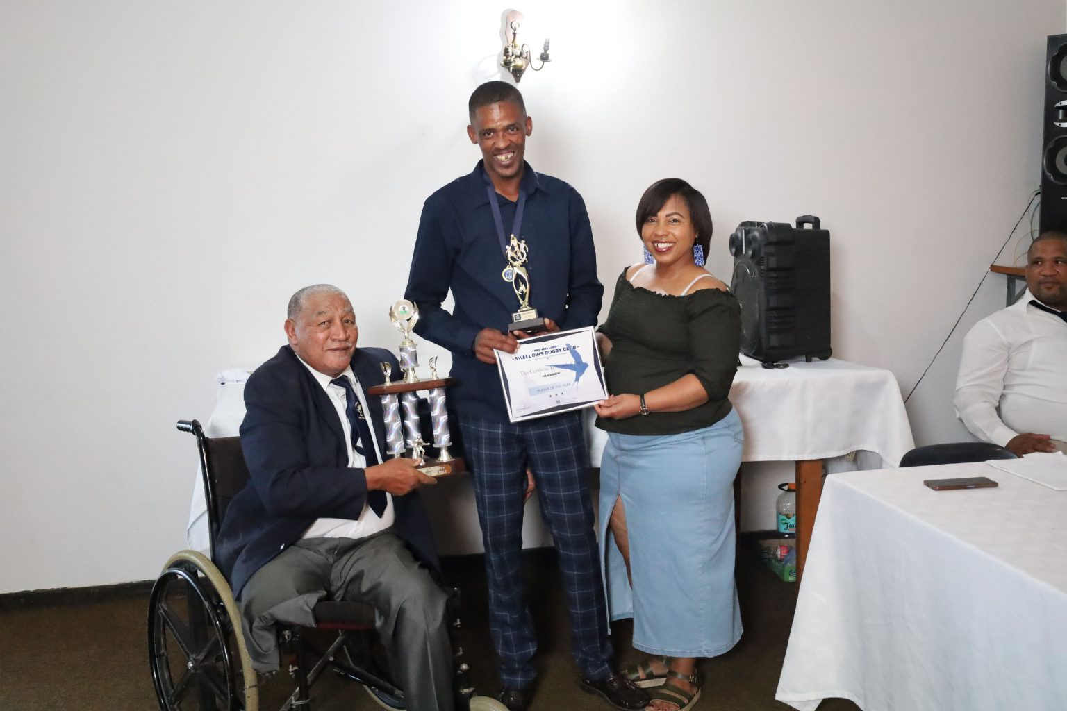 Ivan Motta Agnew received the Prestigious Player of the Year Award at the Club's recent Annual Awards Ceremony at the Albany Sports Club. Swallows Honorary Life President Ralph Douglas (left) handing over the award with Secretary Cindy Bokbaard (right). Photo: Kivitts Photography