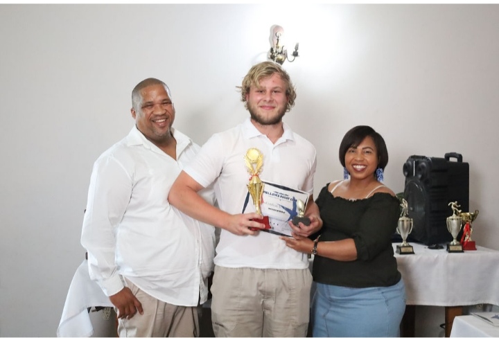 Nathan Myburgh received the Swallows Young Breakthrough of the Year Award from Eugene Jansen (Coach) and Cindy Bokbaard (Secretary). Photo: Kivitts Photography 