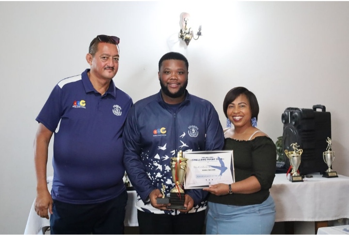 Wonga Wakashe received the Swallows Players Player of the Year Award from Elroy Plaatjies (Forwards Coach) and Cindy Bokbaard (Secretary). Photo: Kivitts Photography 