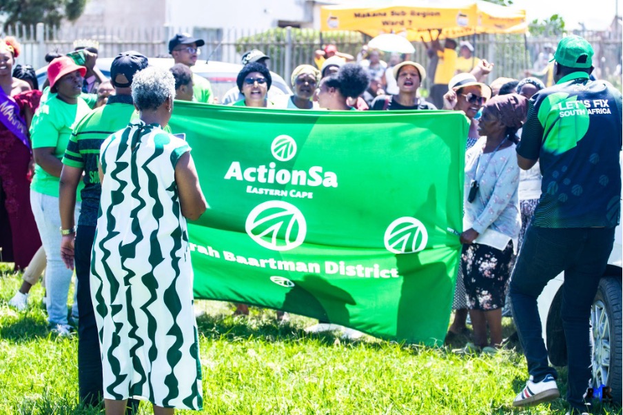 Local residents and ActionSA supporters singing and danacing at the Extension 9 Community yard while being denied access to the hall by ANC supporters. Photo: Azlan Makalima