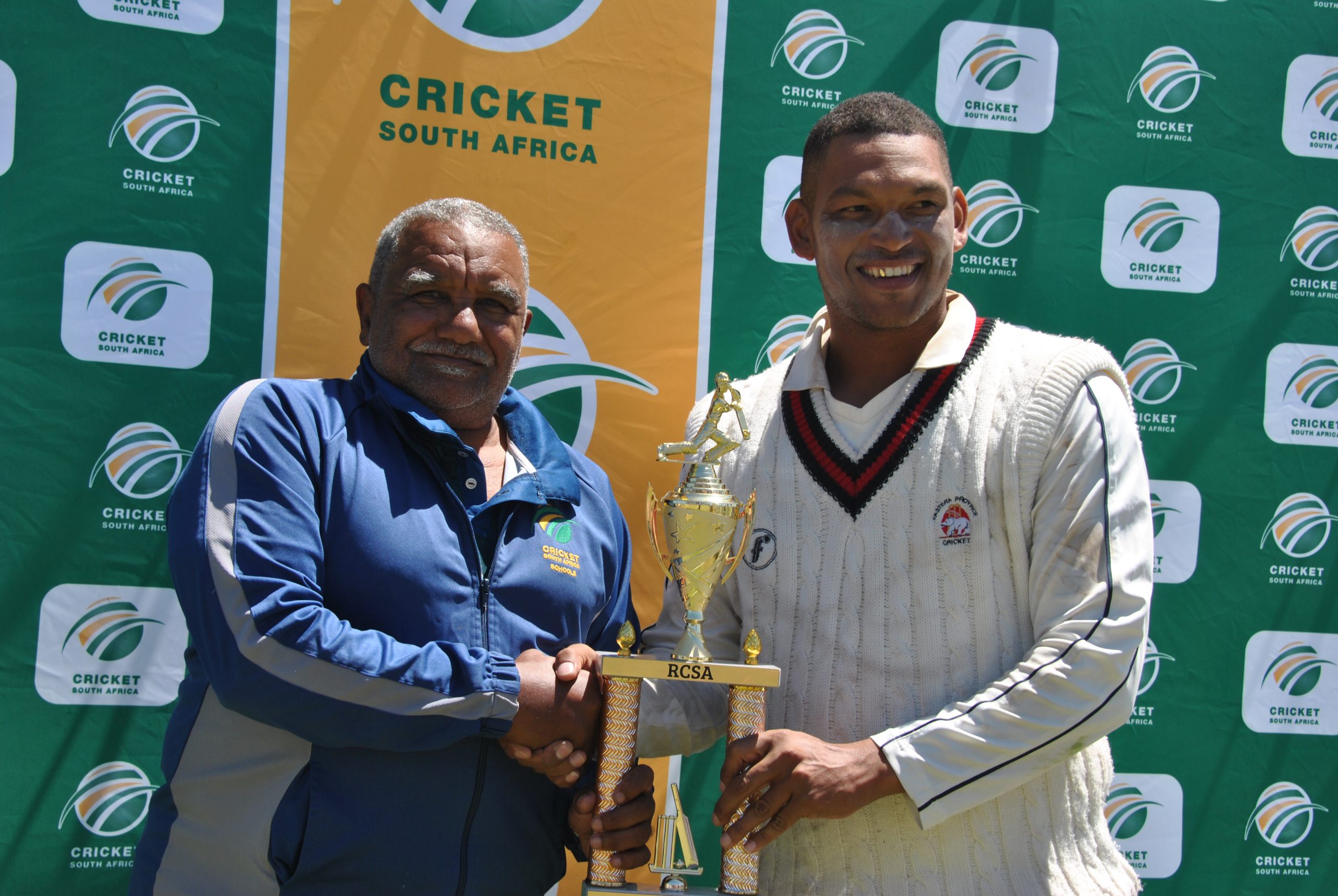 Leon Coetzee, President of Rural Cricket South Africa (left) handing over winners Trophy to Cariston Haarhoff (right), the victorious captain of EP. Photo: Daniels Media
