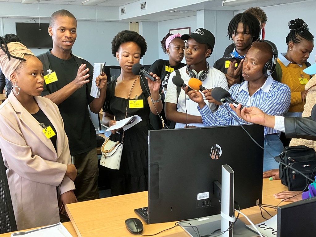 Students ask questions and make recordings at the radio studios of the SABC in Gqeberha. Photo: Steven Lang