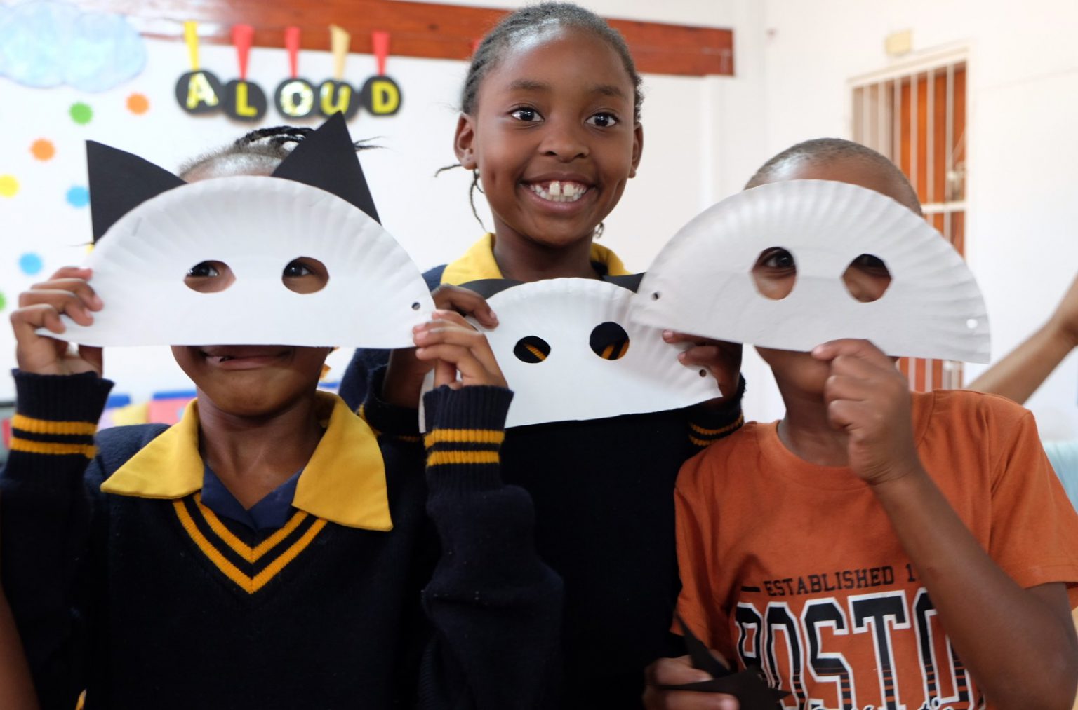 Kitten masks: St Mary’s DCC children captured in the process of making their kitten masks after hearing a Nali’bali story, ‘The Lost Kitten’, at a World Read Aloud Day event at the centre on Wednesday. Photo: Rod Amner