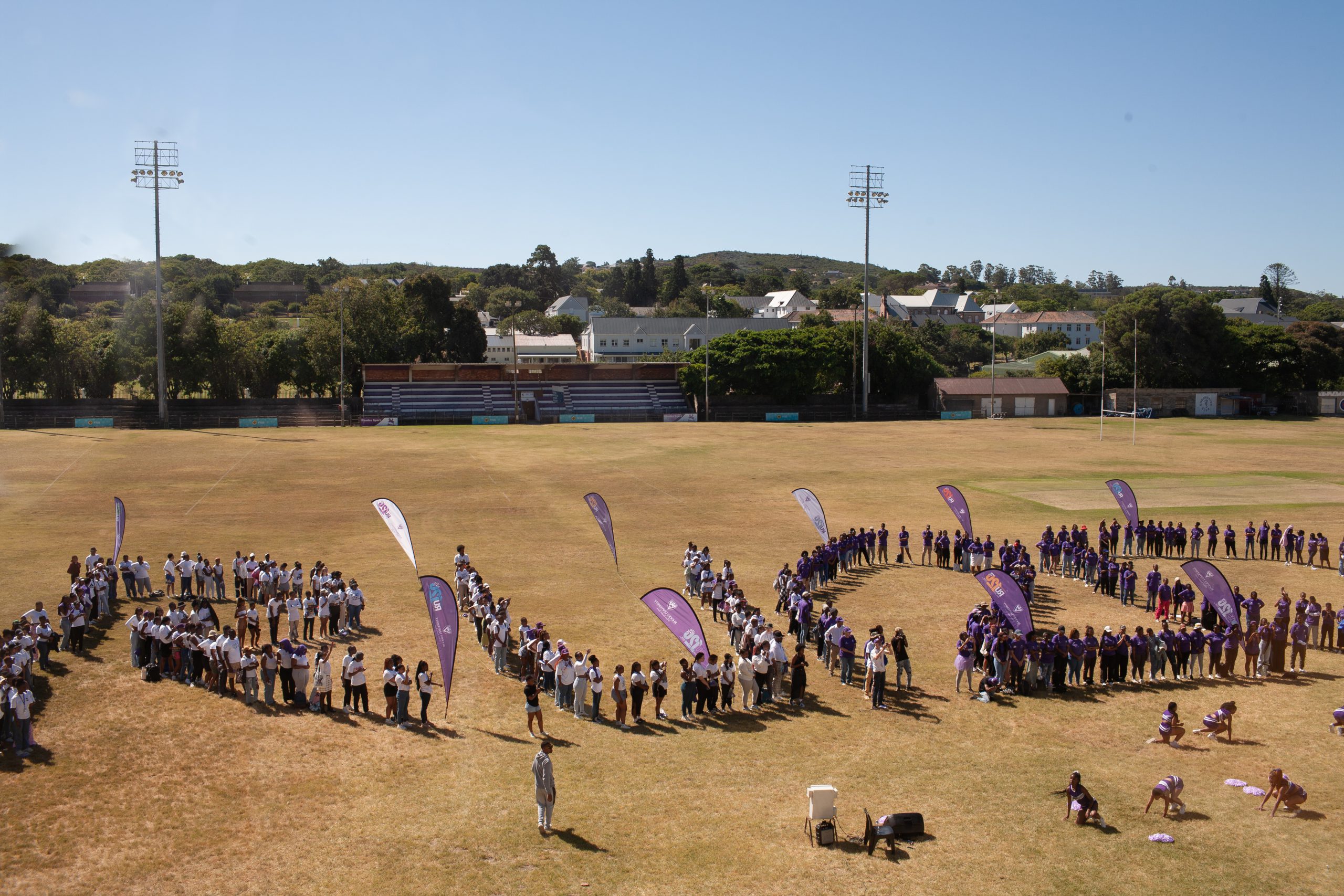Rhodes university staff and students lining up for the RU120 formation. Photo: Rikie Lai