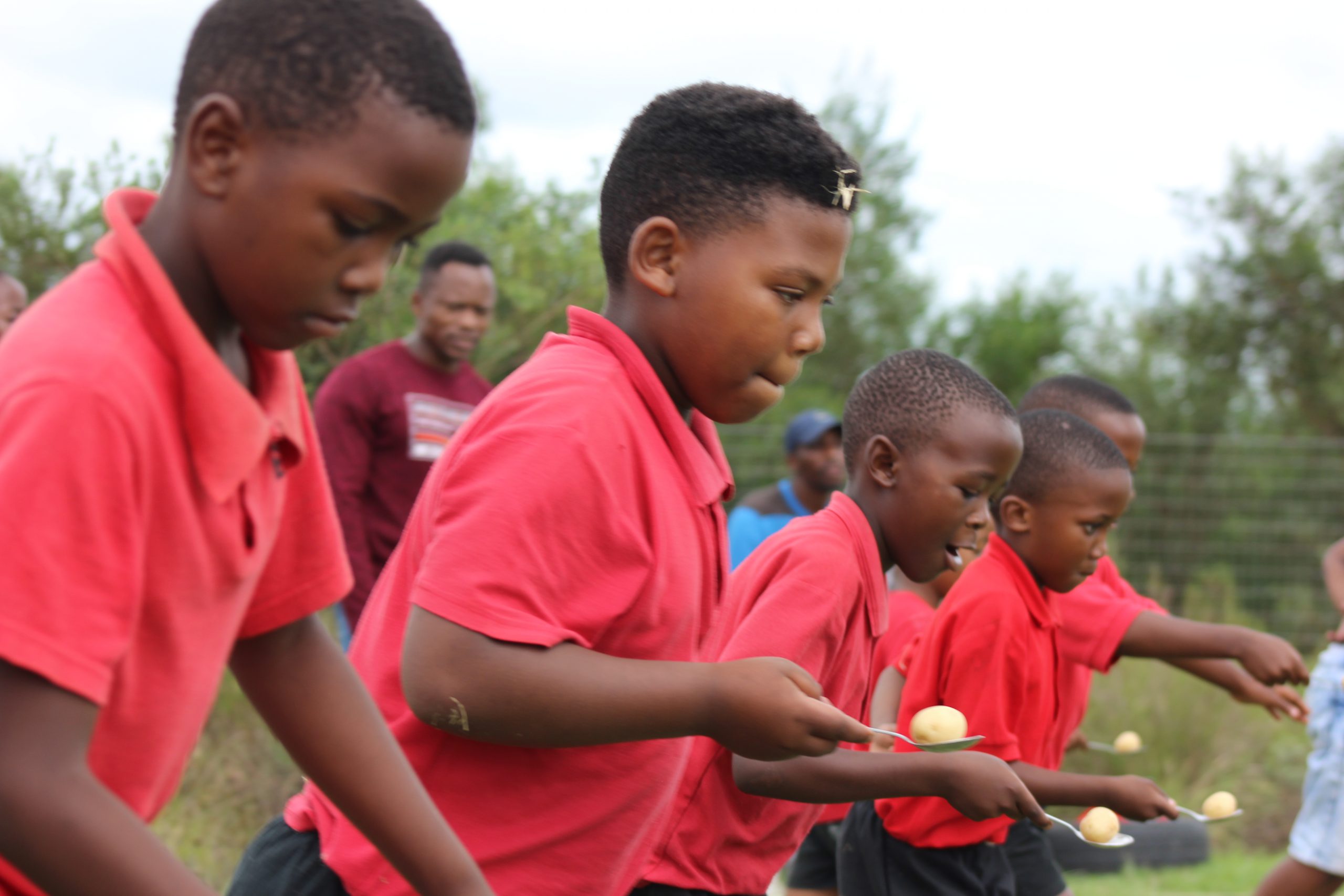 Holy Cross learners participating in potato balancing on sports day. Photo: supplied