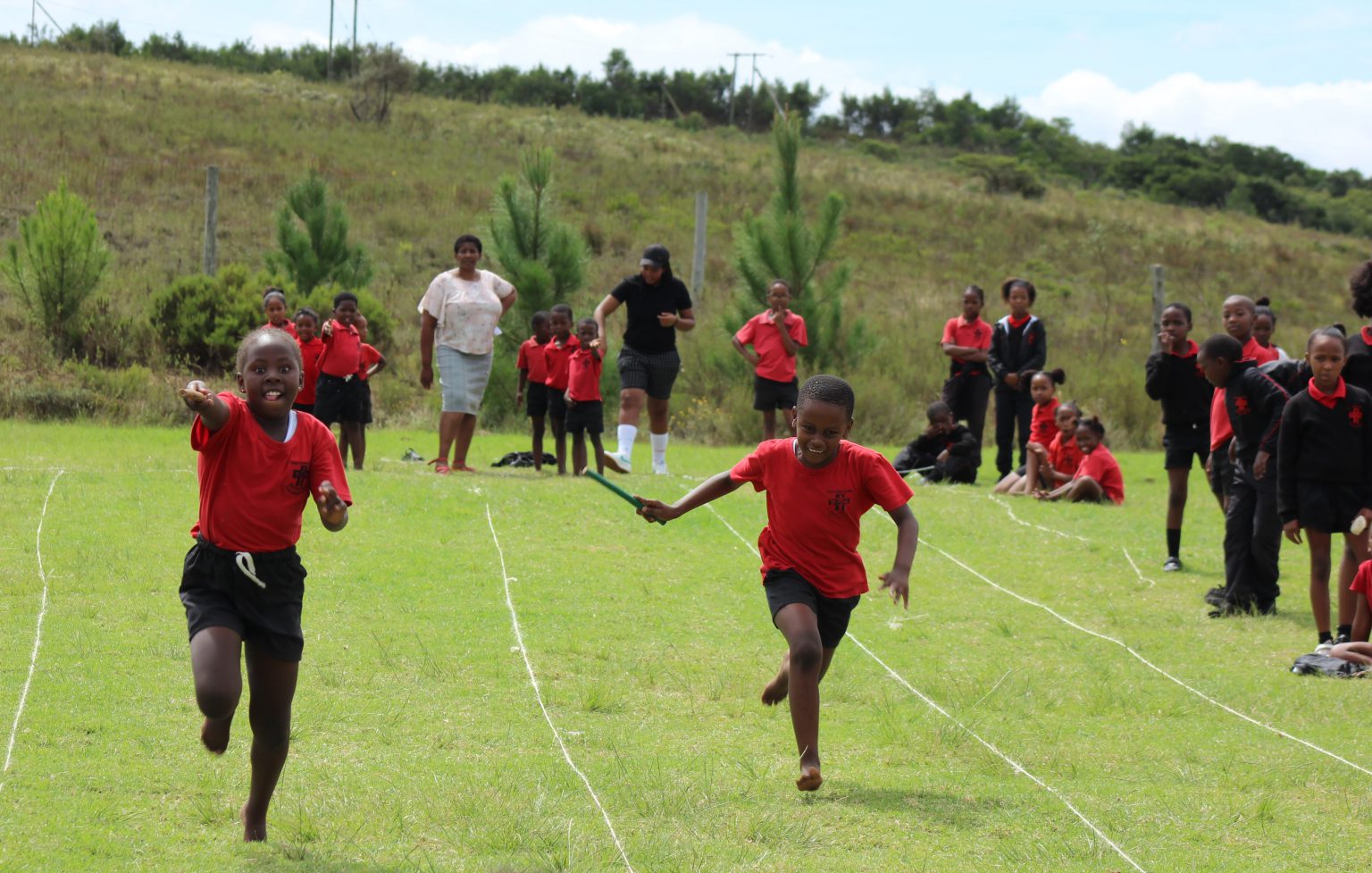 Holy Cross learners participating in a relay race on sports day. Photo: supplied