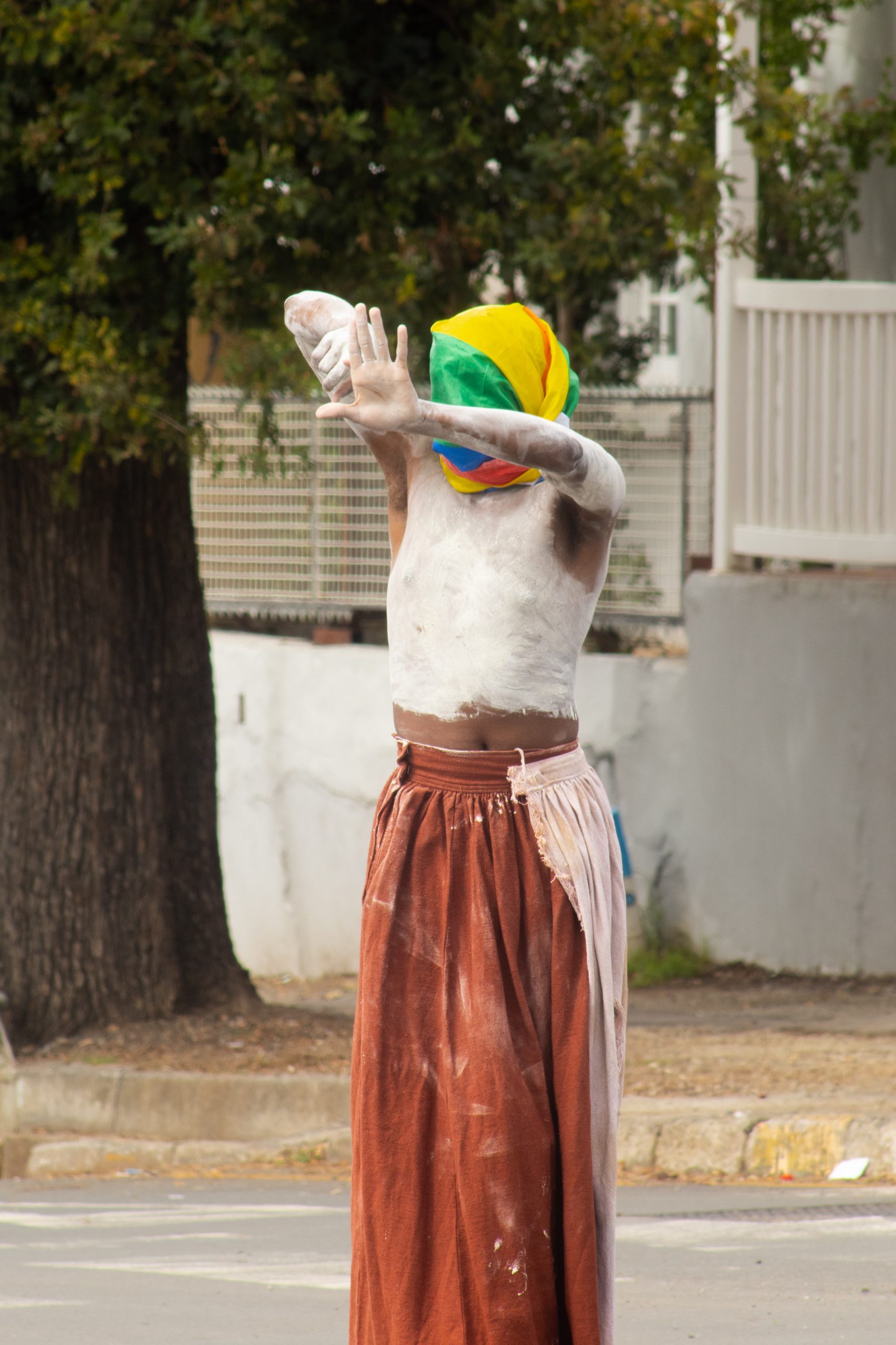Sange Mpambani performing an intervention at the intersection of African Street and Somerset street photo by Rikie Lai
