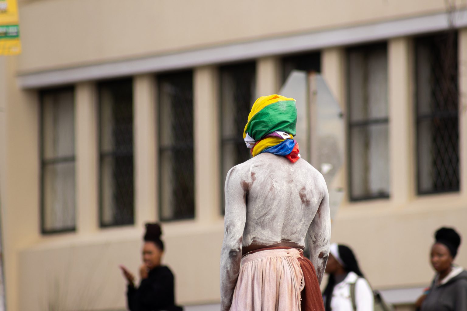 Sange Mpambani performing an intervention at the intersection of African Street and Somerset street photo by Rikie Lai