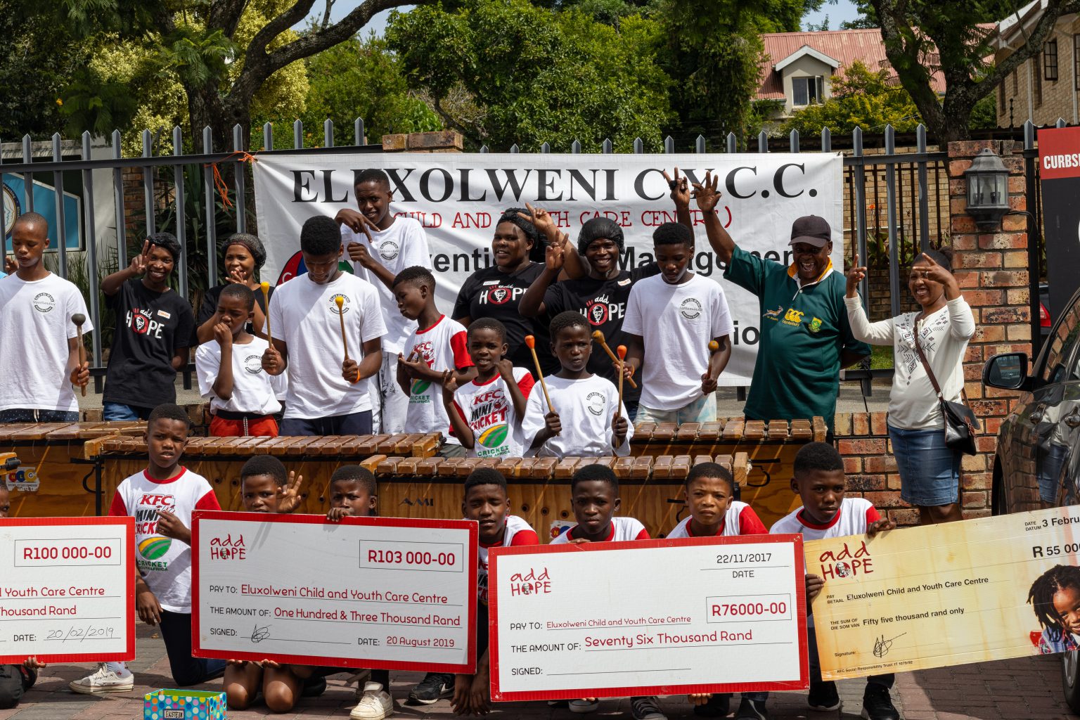 Eluxolweni Child and Youth Care Centre with Peppergrove KFC staff displaying the contributions made by Add Hope. Photo: Rikie Lai