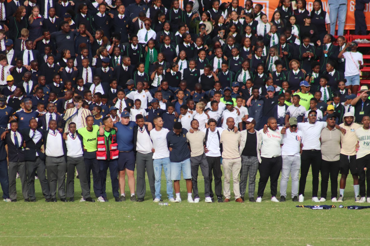 Old Graeme boys join the current Graemians at half-time, chanting their school song as a half-time tradition. Photo, Nothando Yolanda Tshuma.