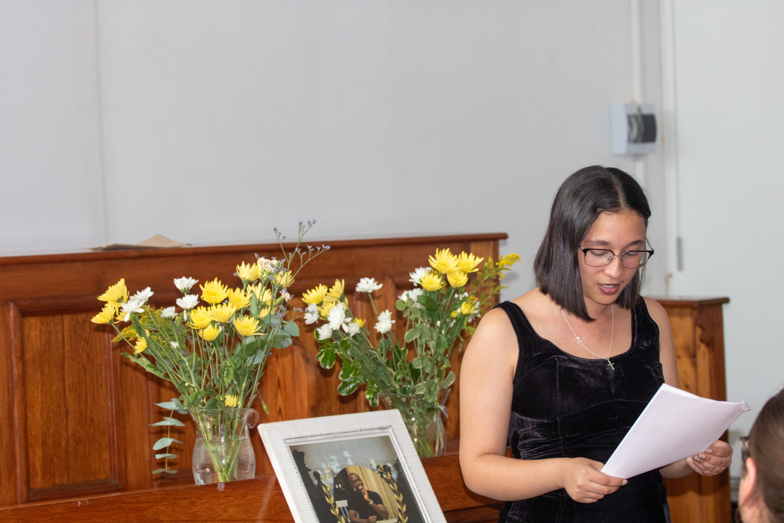 Thembelani's friend, Megan Goliath reading the eulogy at his memorial service. Photo: Linda Pona