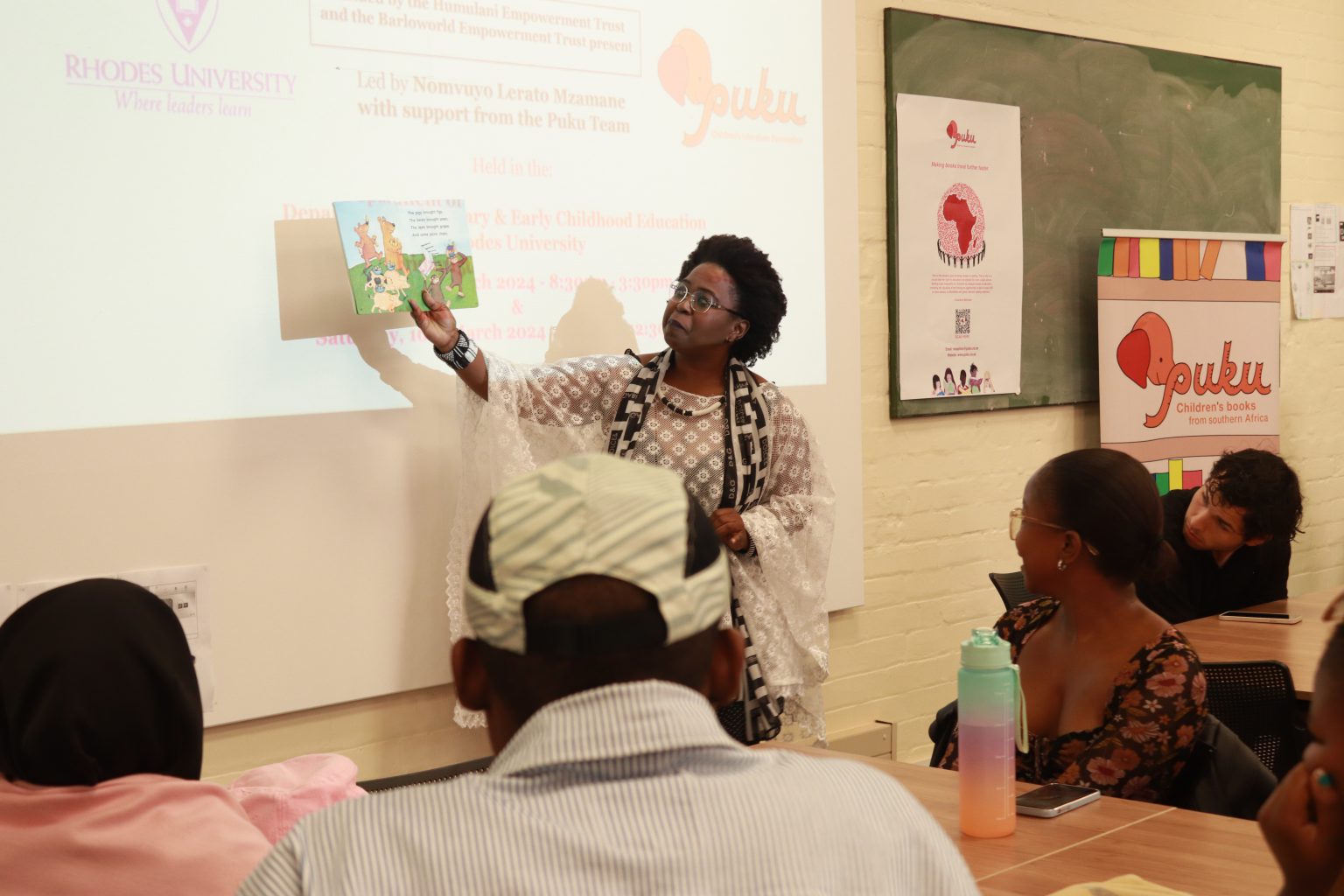 Nomvuyo Mzamana, reading a children's book for students at science lab, education department Friday last weekend. Photo: Khanyisa Khenese.