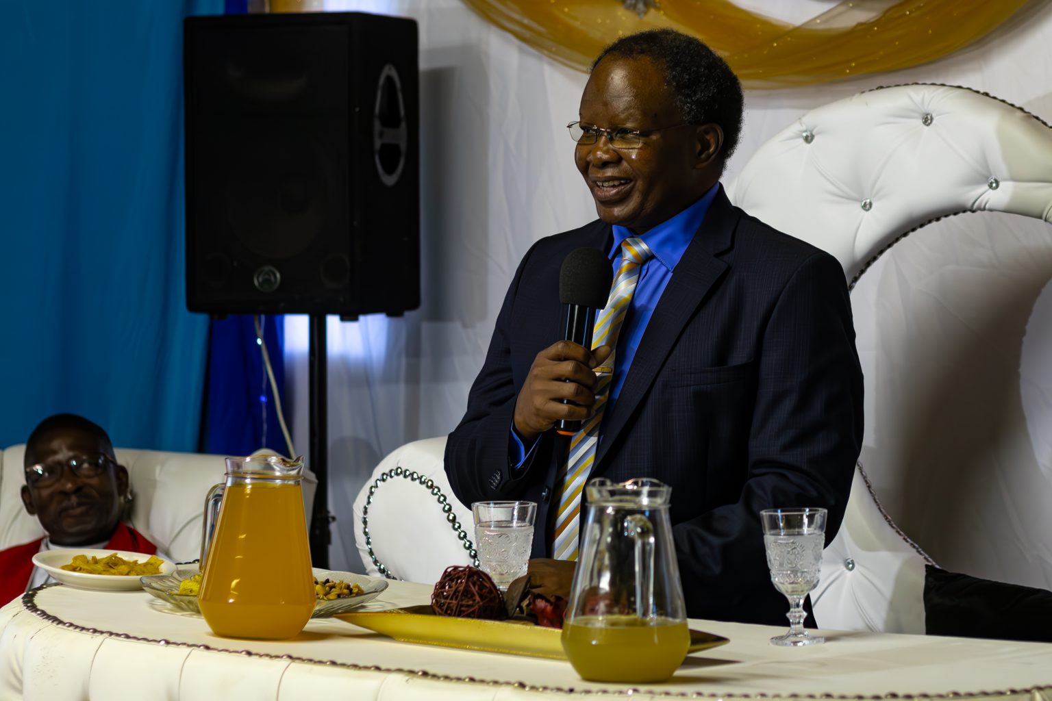 Reverend Mluleki Raymond Ndabeni speaking at his honorary dinner at the Mluleki Raymond Ndabeni Hall photo by Rikie Lai