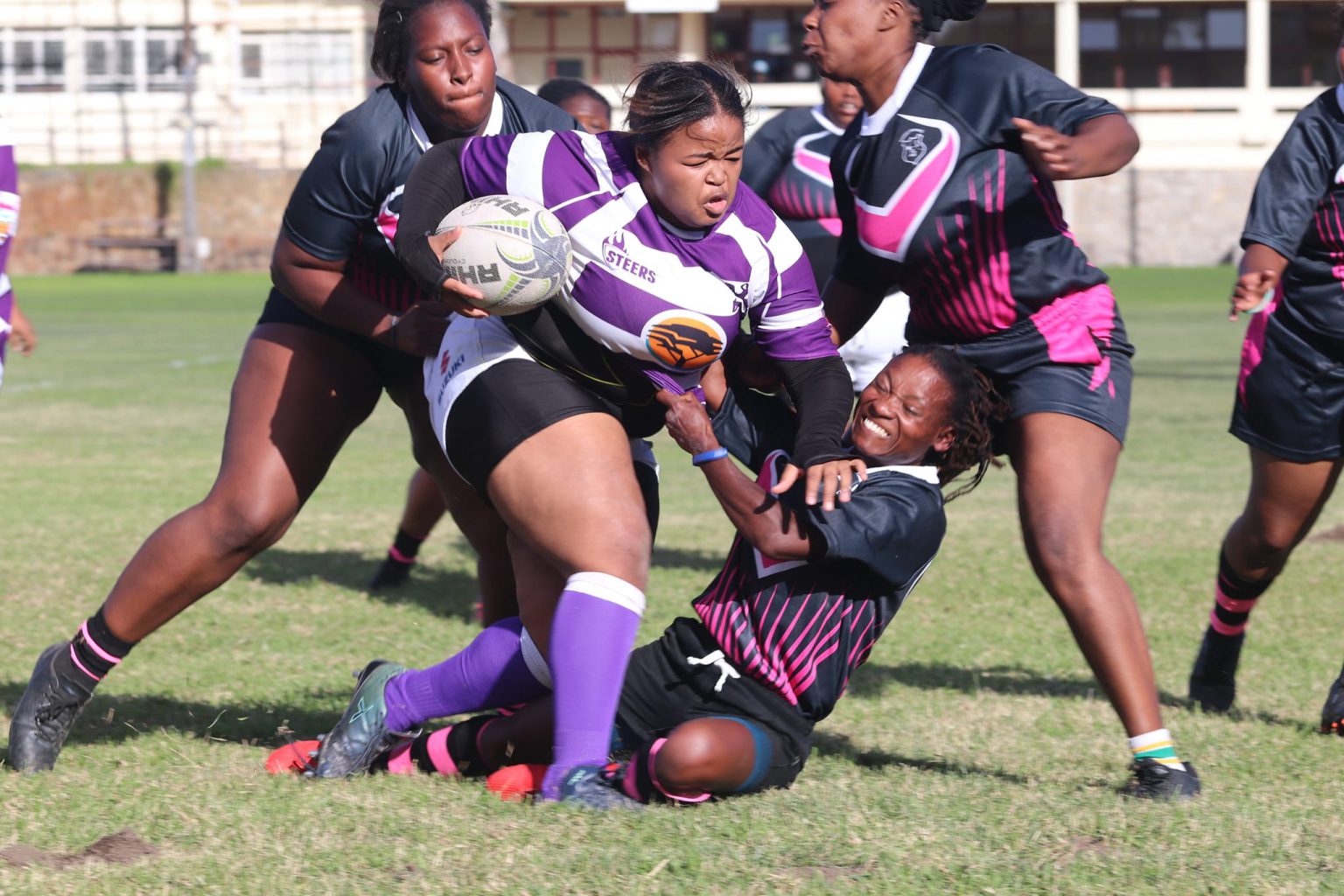 Paula Israel of Alicedale United Women attempted a tackle on the big forward of Rhodes on Saturday at the Great Field. Alicedale Women went on to win 29-0. Photo by Ovayo Novukela