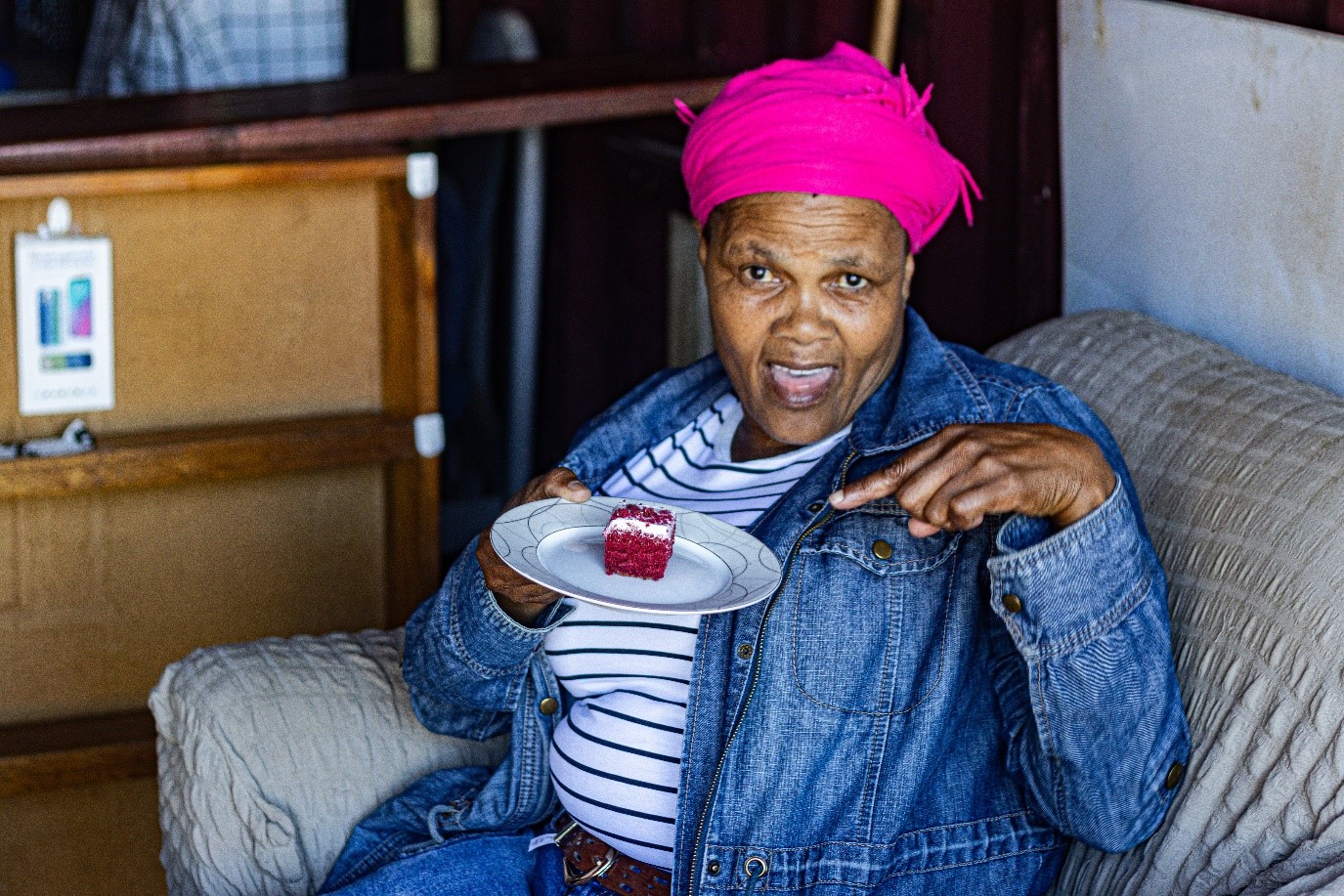 Savouring a moment of joy at eSandton 046. Nomakhaya Busani indulges in a delightful treat. Photo: Siqhamo Jama