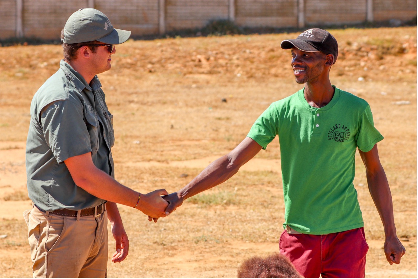 Having the clothing sales in Alicedale every second month allows the Shamwari staff members to form relationships with the community members. Niklaus (left) warmly greets one of the local community members (right). Additionally, some of the ladies who bought clothes, work at some of Shamwari’s lodges, so they know the conservation guides through work. Photo: Abigail Van der Hoven