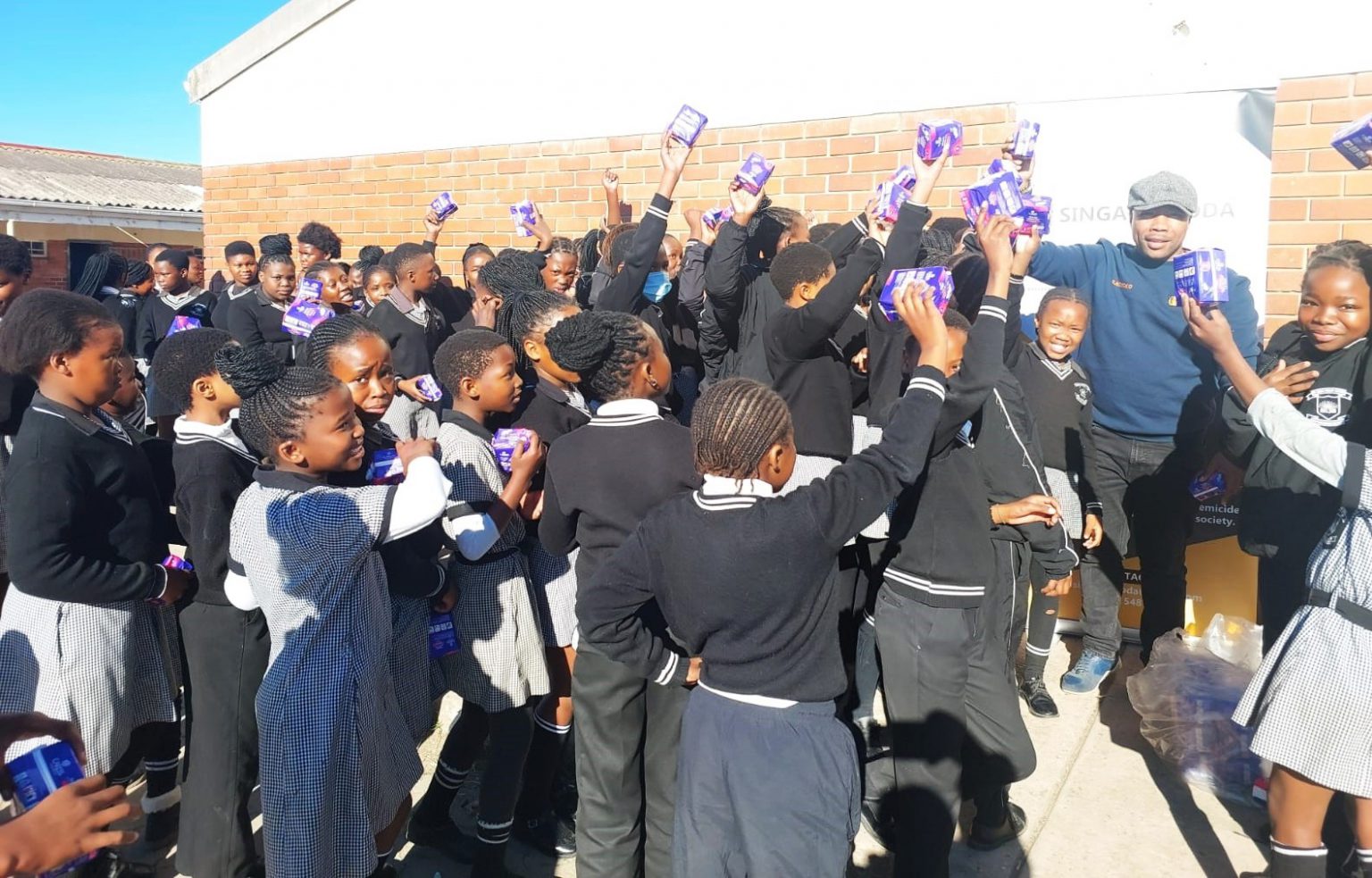 DD Siwisa Primary School learners excited to receive sanitary towels from the founder of a Joza-based men's organisation. Photo: Supplied