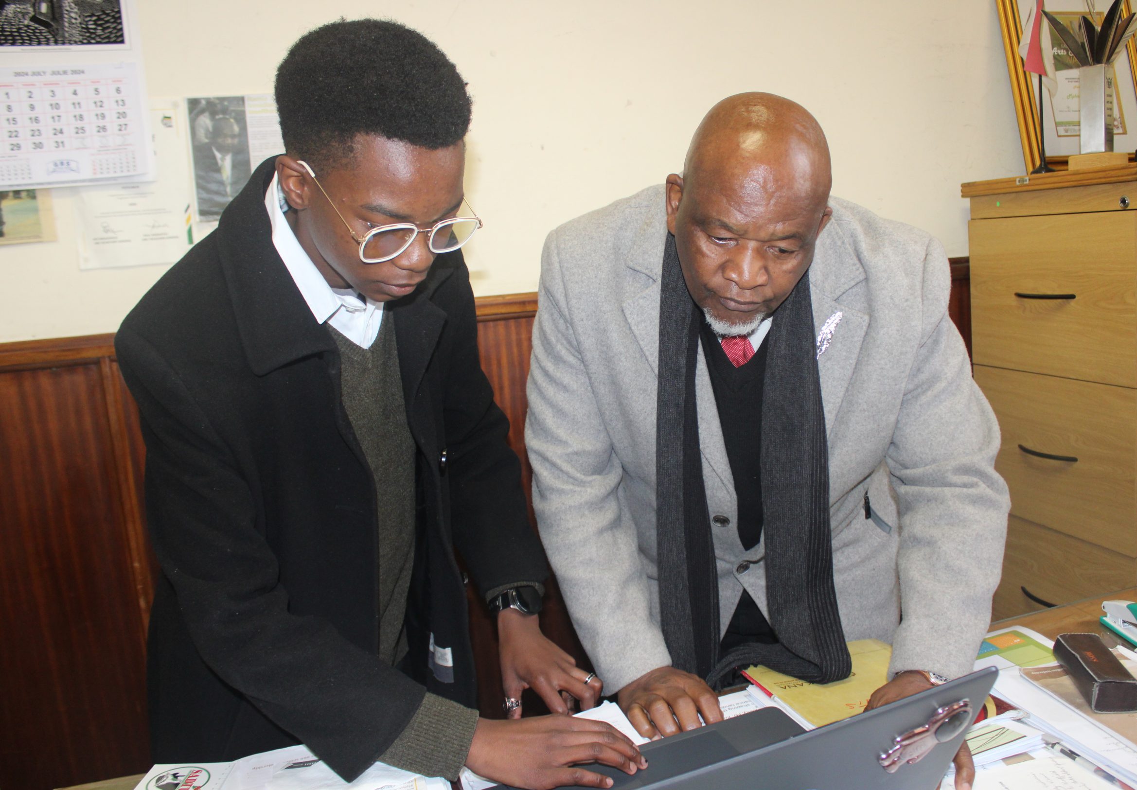 Robben Island ambassador Tukela Seyisi (left) with Makana ward councillor Ramie Xonxa working on plans for the upcoming youth empowerment programme. Photo: Luvuyo Mjekula