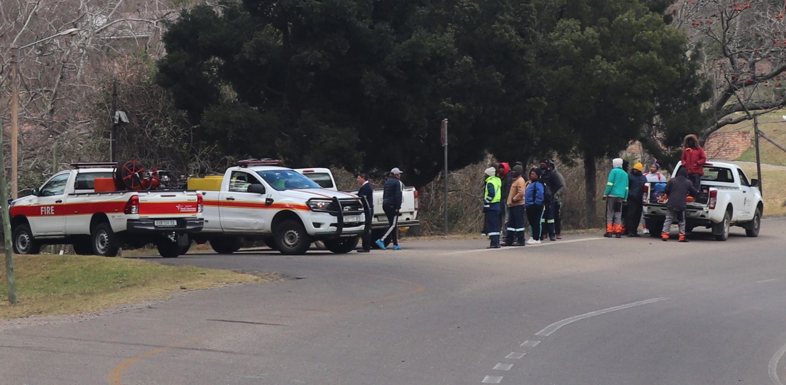 Makana Municipality workers inspecting the area near Makana Resort after a wildfire razed two park homes in the area earlier this week. Photo: Khanyisa Khenese