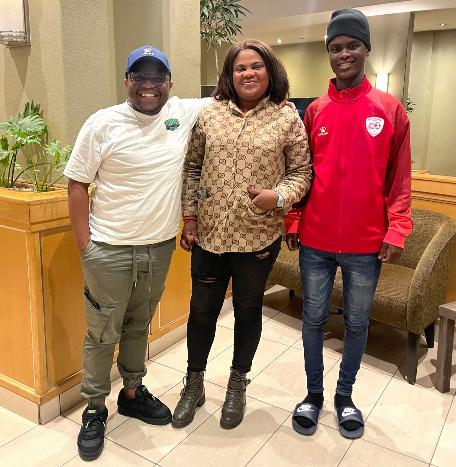 Olwethu Songelwa (right) with Sekhukhune United officials in their offices. Photo: Supplied