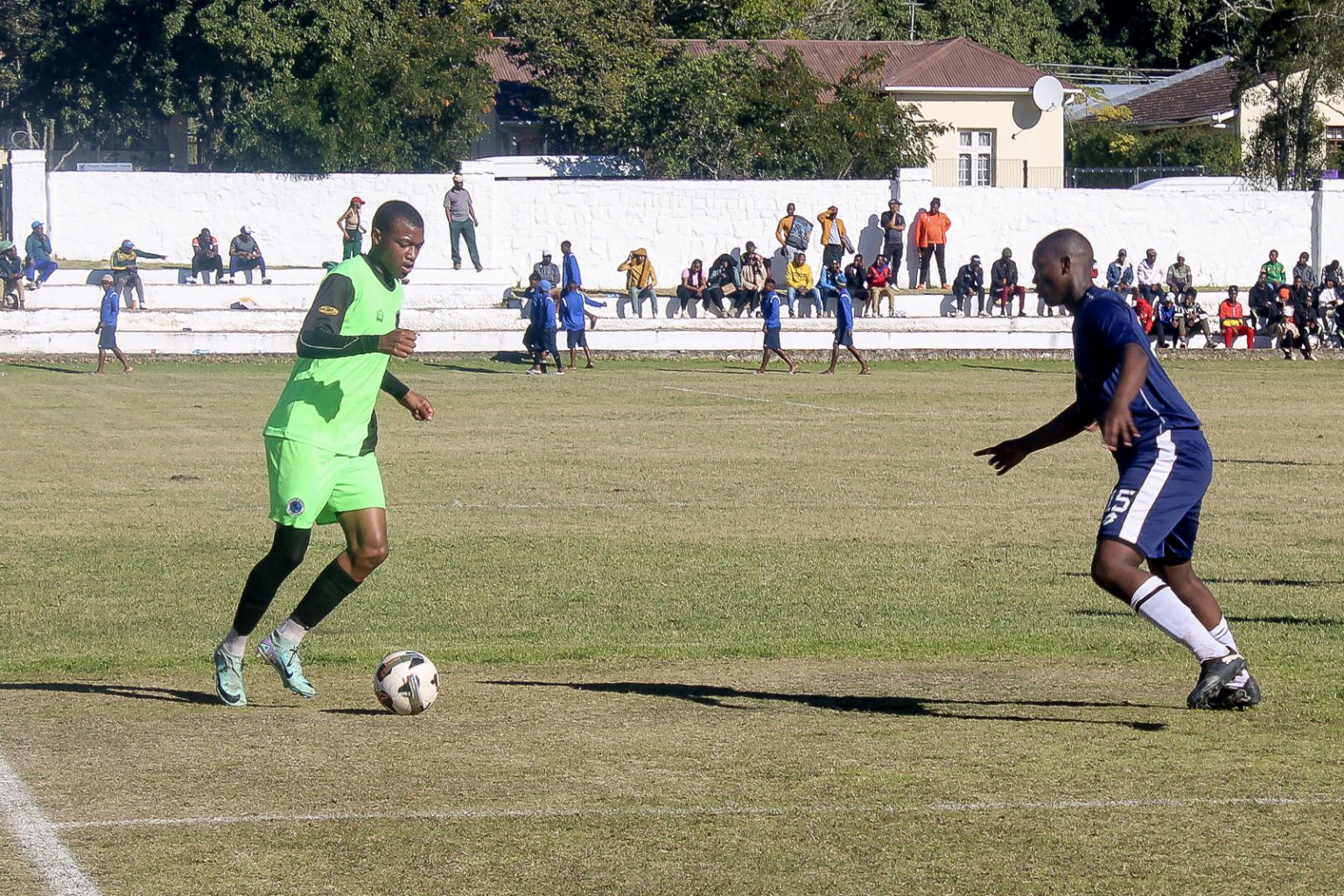 Maru FC's attacker Mahle Sauti (left) on the offensive against Musketeers FC at Rhodes University this past weekend. Maru became the first ever Makhanda team to gain promotion to the ABC Motsepe League. Photo: Chris Totobela