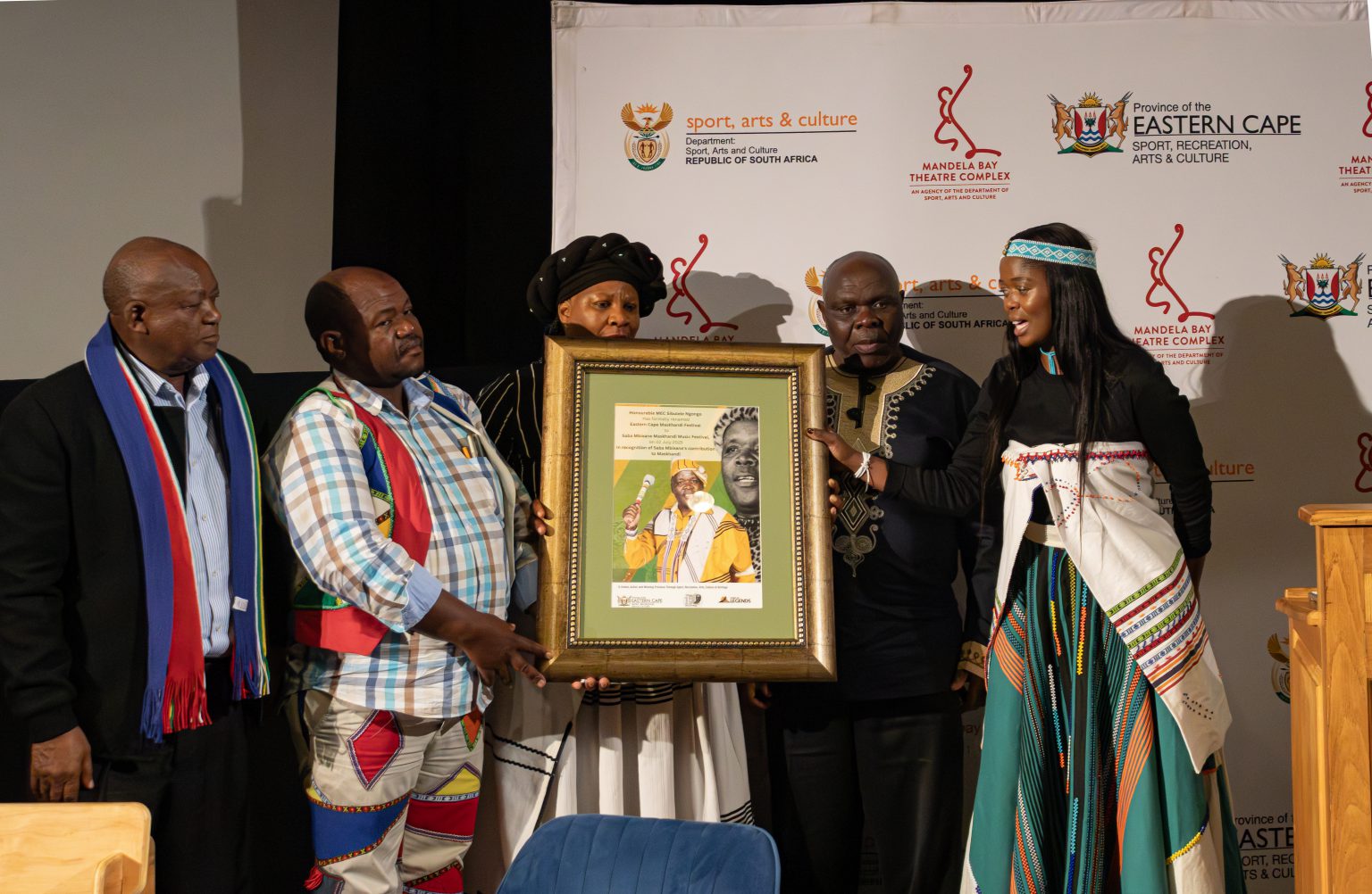 Saba Mbixane's family receiving a gift to honour his legacy. Photo: Sinesipho Habana