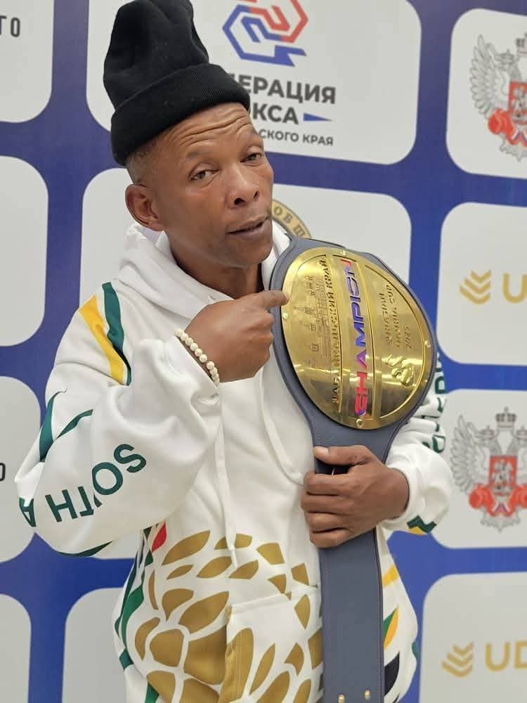 Makhanda's Luyanda "Tyson" Dibela of Mfuzo Boxing Club showing off his world title belt. Photo: Chris Totobela